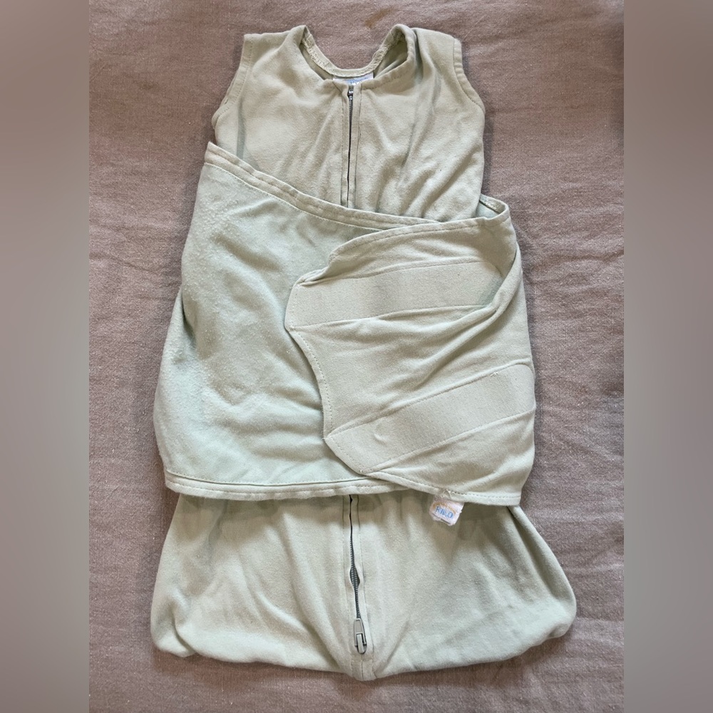 Sage green cotton newborn halo sleep sack swaddle
